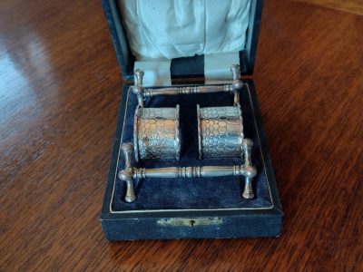 Antique Knife Rests and Napkin rings in Original Display Box.Front View